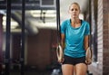 Raise yourself to new hights. a young woman working out with gymnastics rings in a gym. Royalty Free Stock Photo