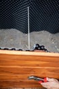 A raised bed made of wood planks is built in the garden, wire mesh against voles