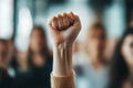 Raised fist in a crowd. Concept of strength, unity, solidarity in a protest Royalty Free Stock Photo