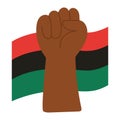 Raised fist in front of Pan-African flag symbolizing Juneteenth freedom Royalty Free Stock Photo