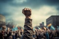 A raised fist of a protestor. large group of protesters. Generative AI