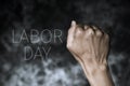 Raised fist and text labor day