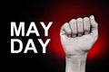 Raised fist and text may day