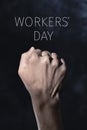 Raised fist and text workers day