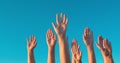 Raised hands against blue sky Royalty Free Stock Photo