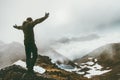 Raised hands Man on foggy mountain summit Royalty Free Stock Photo