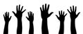 Raised hands vector silhouette, several hand raising, protest concept, togetherness idea silhouette, black color isolated on white Royalty Free Stock Photo