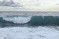 Raised level after the passage of the tanker rushes to the shore. Beautiful colorful sky along with a clean and perfect wave for