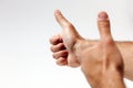 Raised thumbs isolated on a white background. Symbol of success Royalty Free Stock Photo