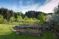 raised vegetable beds in the rural natural garden with orchard