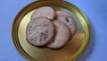 Raisin biscuits with sprinkles sugar topping on a golden plate