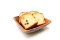 Raisin bread toast on the wooden plate isolated on a white background. Royalty Free Stock Photo