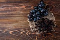 Raisin and grapes on dark wooden background Royalty Free Stock Photo