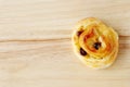 Raisin roll on wood background