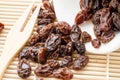 Raisin on white cup on wooden spoon fork Royalty Free Stock Photo