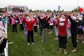 Raising hands at Avon Walk for Breast Cancer