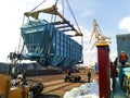 Raising the hopper car for unloading on a cargo ship. Lifting operations in the port.