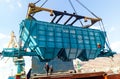Raising the hopper car for unloading on a cargo ship. Lifting operations in the port
