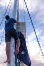 Raising the sails at sunset to get to the shores of Lahaina Royalty Free Stock Photo