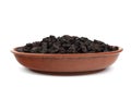 Raisins in bowl isolated over white background