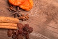 Raisins, cinnamon, anise and dried apricots lying on an old wood