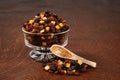 Raisins currants and sultanas with mixed candied peel in a glass bowl with wood spoon Royalty Free Stock Photo