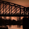 Raiway bridge, silhouette of steel construction, sunset view, Prague Royalty Free Stock Photo