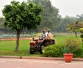 Raj Ghat Cremation Gardeners on a tractor