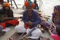 Rajasthan Famous Sarangi Musical Instrument being played at street near Gangor Ghat Pichola Lake. Traditional folk musicians sings Royalty Free Stock Photo