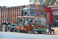 Bright agricultural truck Tata at an intrurban road.