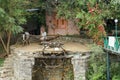 The Rajasthani farmer with his ox spins a water wheel to draw water from the river