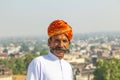 Rajasthani man with bright orange turban and bushy mustache