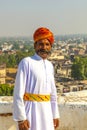 Rajasthani man with bright orange turban and bushy mustache