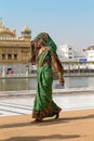 Rajasthani woman visiting the Golden Temple in Amritsar, Punjab, India. Royalty Free Stock Photo