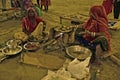 The Rajasthani women preparing traditional foods in a fair.