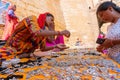 Rajasthani women selling and negotiating price of jewelleries with female tourist