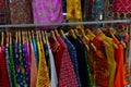 Rajasthani womens clothes  are hanging for sale , being displayed in a shop at famous Sardar Market and Ghanta ghar Clock tower in Royalty Free Stock Photo