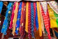 Rajasthani womens clothes, are hanging for sale , being displayed in a shop at famous Sardar Market and Ghanta ghar Clock tower in Royalty Free Stock Photo