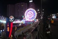 Rajkot, Gujarat, India, 06-09-2023, Glowing Wonder: Vibrant Neon Ferris Wheel at Night