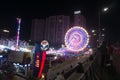 Rajkot, Gujarat, India, 06-09-2023, Long View of Glowing Wonder: Vibrant Neon Ferris Wheel at Night