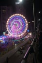 Rajkot, Gujarat, India, 06-09-2023, Portrait View of Electric Nights at the Carnival: Enchanting Rides with Big Ferris Wheel