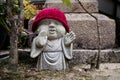 Rakan statue with red hat in Daishoin temple in Miyajima island, Japan