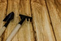 Rake and shovel on wooden background