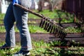 Rake work on a garden plot on a spring day Royalty Free Stock Photo