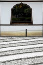 Raked sand lines and window Royalty Free Stock Photo