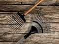 Rakes on old wood background