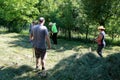 Putting the grass on the trailor. Farm chores, working on a field.