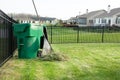 Raking lawn clippings on a suburban estate Royalty Free Stock Photo