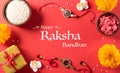 Raksha Bandhan, Indian festival with beautiful Rakhi and Rice Grains on red background. A traditional Indian wrist band which is