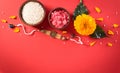 Raksha Bandhan, Indian festival with beautiful Rakhi and Rice Grains on red background. A traditional Indian wrist band which is